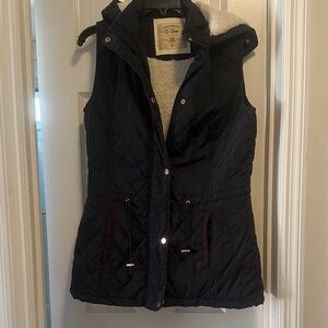 Women's Quilted Navy blue Vest with soft lining and a hood. Pockets.